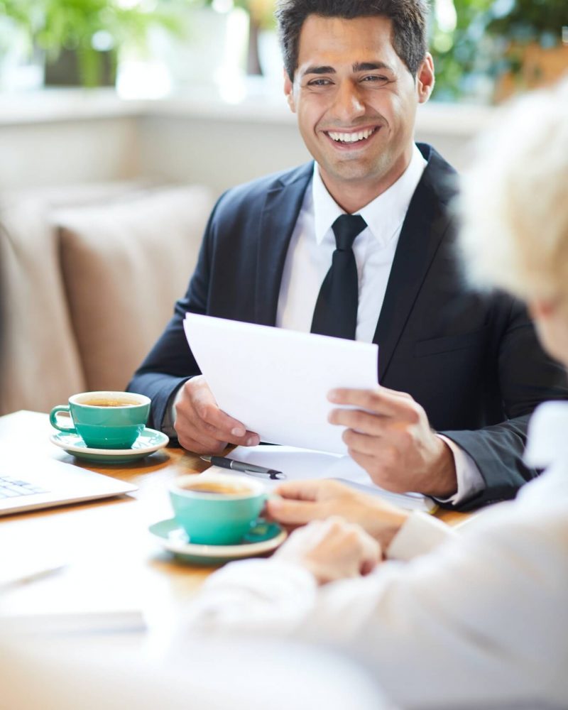 cheerful-lawyer-talking-to-client-in-cafe-1.jpg